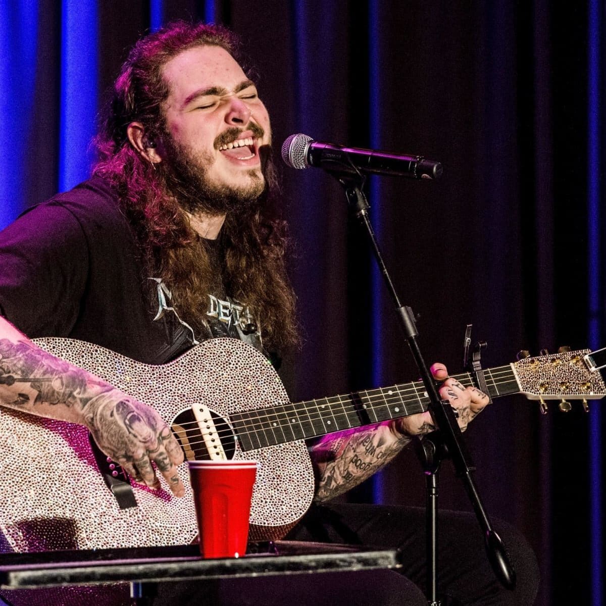 Watch Post Malone Grab a Guitar and Debut His New Moody Sound With "Stay" - Maxim